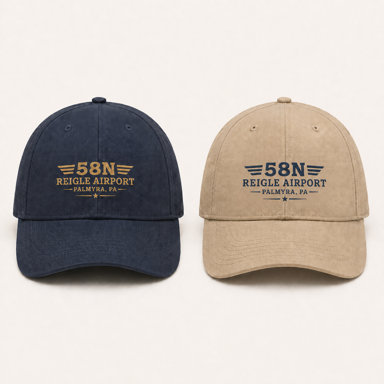 Reigle Airport embroidered caps shown together in aviation blue and tan